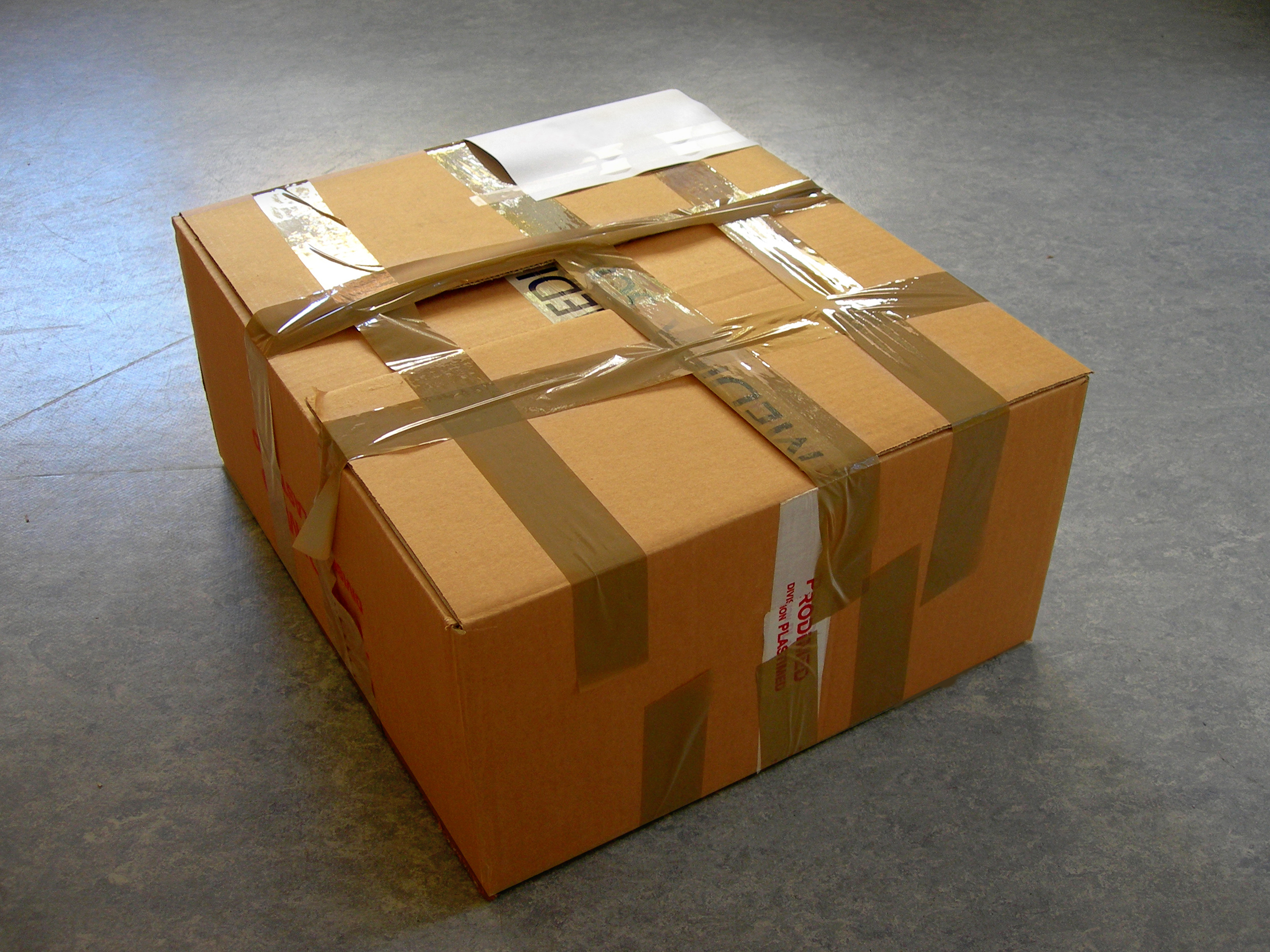 Large brown package covered in tape