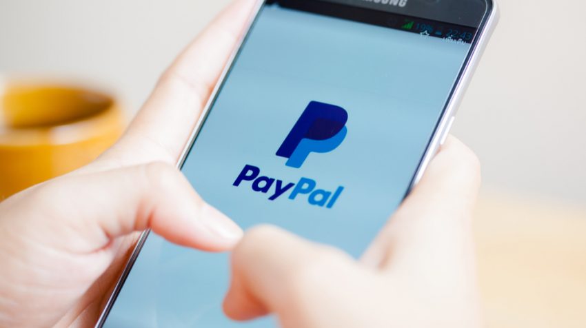Person using the PayPal app on a phone