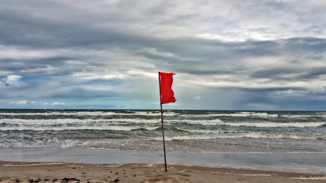 Redflag on beach