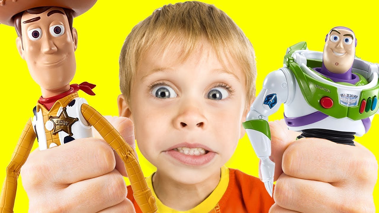 Young boy with Woody and Buzz Lightyear toys